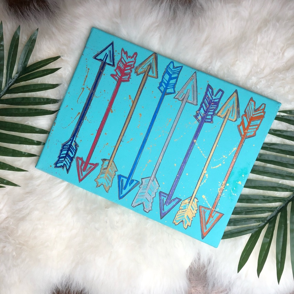 Hand painted arrow design on canvas.